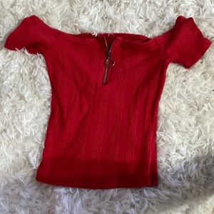 A small red top from aero, soft and stretchy material.